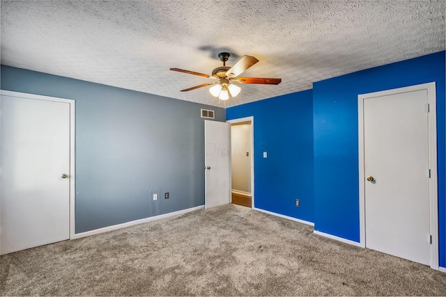 4905 Mckenna Ct, Columbus, OH 43221 - unfurnished bedroom with carpet floors, a textured ceiling, and ceiling fan