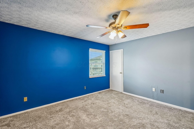 4905 Mckenna Ct, Columbus, OH 43221 - spare room with carpet floors, ceiling fan, and a textured ceiling