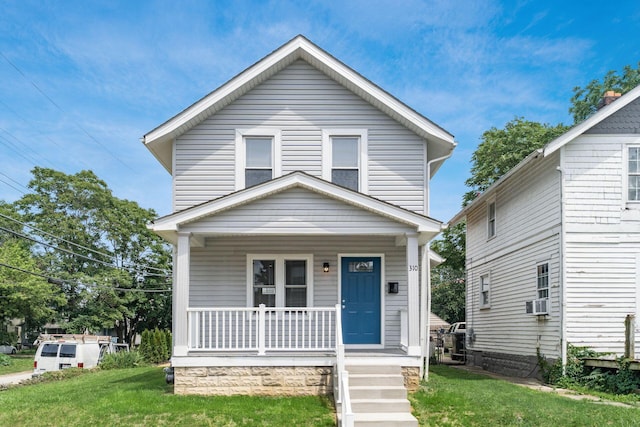 310 S Ogden Ave, Columbus, OH 43204 - traditional style home featuring a porch and a front lawn