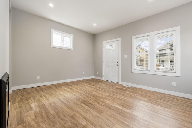 310 S Ogden Ave, Columbus, OH 43204 - unfurnished living room with light wood-type flooring and recessed lighting