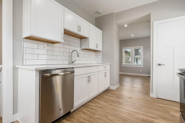 310 S Ogden Ave, Columbus, OH 43204 - kitchen featuring dishwasher, light countertops, tasteful backsplash, light wood-style flooring, and recessed lighting