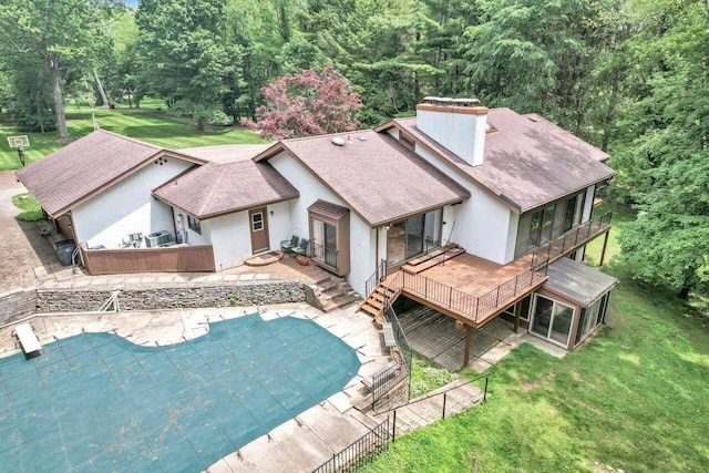 71 Denison Dr, Granville, OH 43023 - rear view of house with a wooden deck, roof with shingles, stucco siding, a lawn, and a chimney