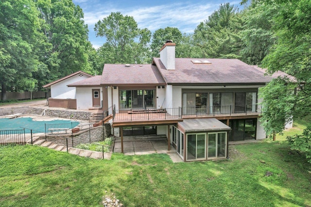 71 Denison Dr, Granville, OH 43023 - rear view of property with a sunroom, a chimney, a patio, stucco siding, and roof with shingles