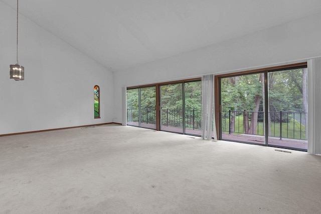 71 Denison Dr, Granville, OH 43023 - empty room with plenty of natural light, carpet, and high vaulted ceiling