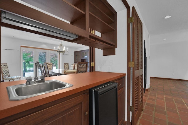 71 Denison Dr, Granville, OH 43023 - kitchen with a chandelier, refrigerator, dark tile patterned floors, recessed lighting, and open shelves