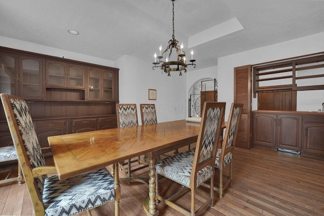 71 Denison Dr, Granville, OH 43023 - dining room featuring a chandelier, hardwood / wood-style flooring, arched walkways, recessed lighting, and a tray ceiling