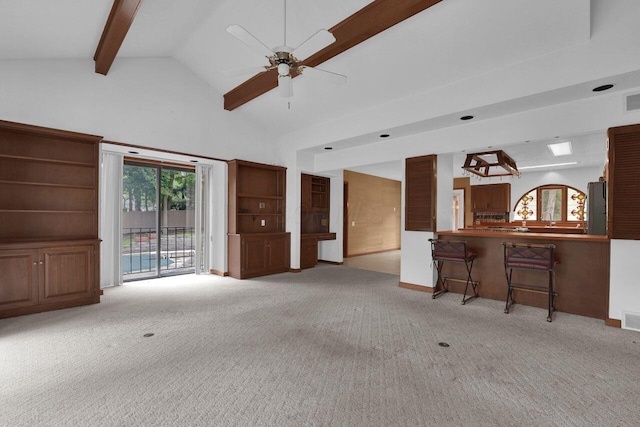 71 Denison Dr, Granville, OH 43023 - living room featuring light colored carpet, beamed ceiling, a ceiling fan, and high vaulted ceiling