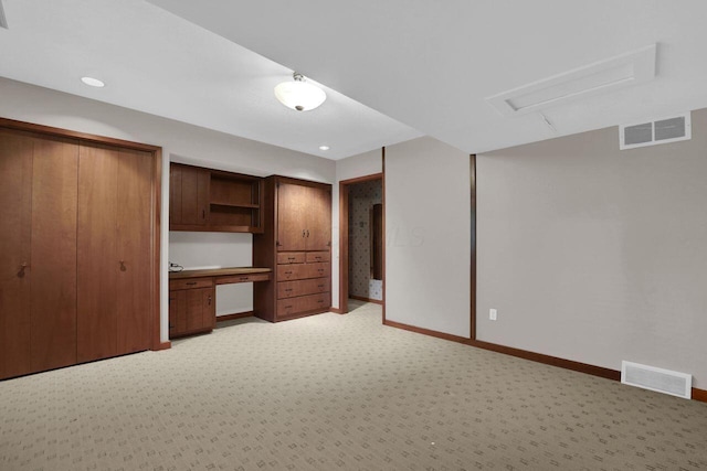 71 Denison Dr, Granville, OH 43023 - unfurnished bedroom featuring light carpet, built in study area, recessed lighting, and attic access