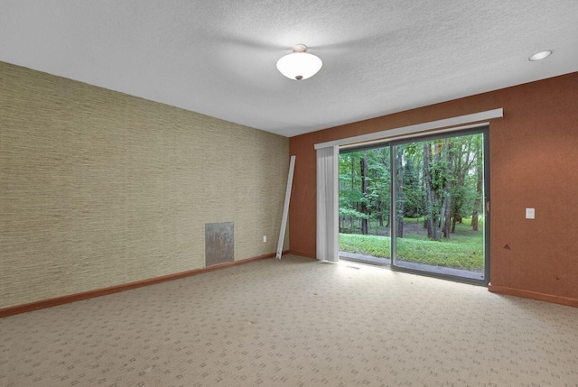 71 Denison Dr, Granville, OH 43023 - empty room with a textured ceiling and carpet floors