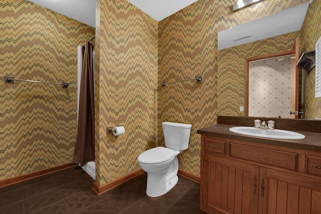 71 Denison Dr, Granville, OH 43023 - full bathroom featuring vanity, a stall shower, tile patterned flooring, and wallpapered walls
