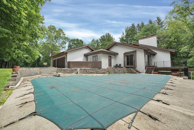 71 Denison Dr, Granville, OH 43023 - view of swimming pool with a covered pool and a deck