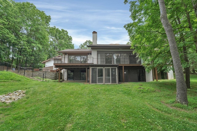 71 Denison Dr, Granville, OH 43023 - back of property with a sunroom, a chimney, and a deck