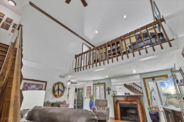 389 Fenway Rd Unit B, Columbus, OH 43214 - living area with a ceiling fan, a tile fireplace, recessed lighting, healthy amount of natural light, and a towering ceiling