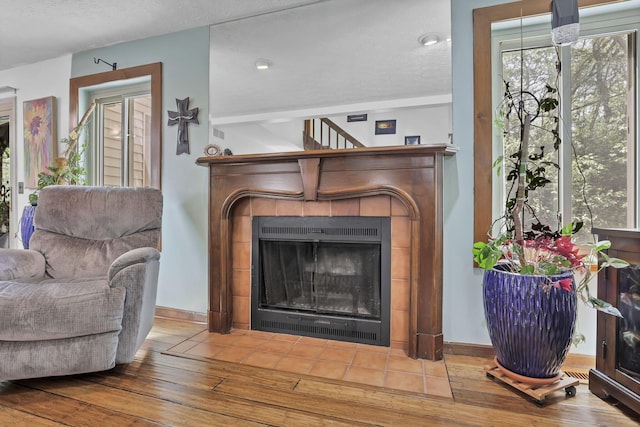 389 Fenway Rd Unit B, Columbus, OH 43214 - living area with hardwood / wood-style flooring and a tile fireplace