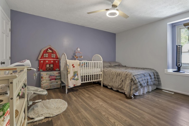 389 Fenway Rd Unit B, Columbus, OH 43214 - bedroom featuring wood finished floors, a textured ceiling, and ceiling fan