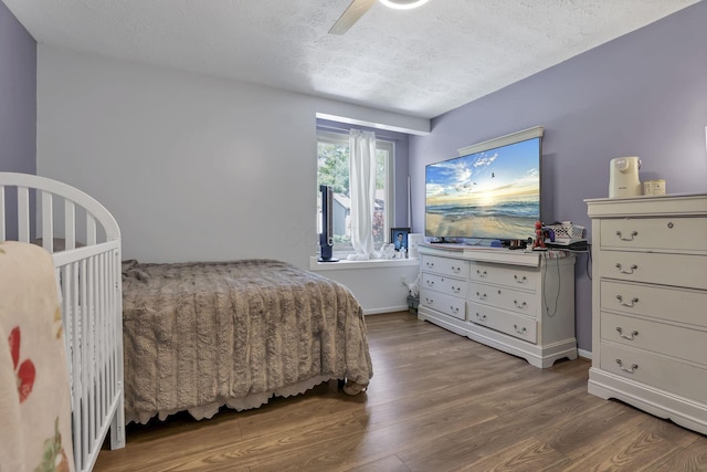 389 Fenway Rd Unit B, Columbus, OH 43214 - bedroom with wood finished floors, a textured ceiling, and a ceiling fan