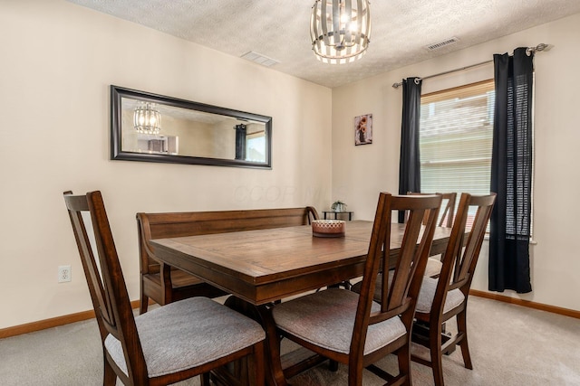 281 Inah Ave, Columbus, OH 43228 - dining space featuring light carpet, a chandelier, and a textured ceiling