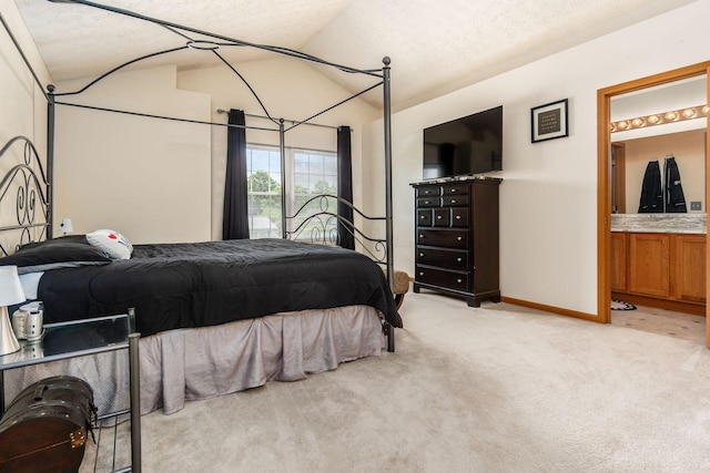 281 Inah Ave, Columbus, OH 43228 - bedroom with light carpet, lofted ceiling, ensuite bath, and a textured ceiling