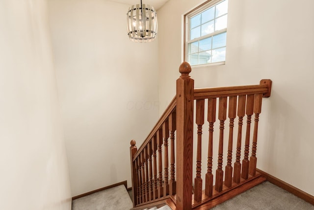 281 Inah Ave, Columbus, OH 43228 - staircase with carpet floors and a chandelier