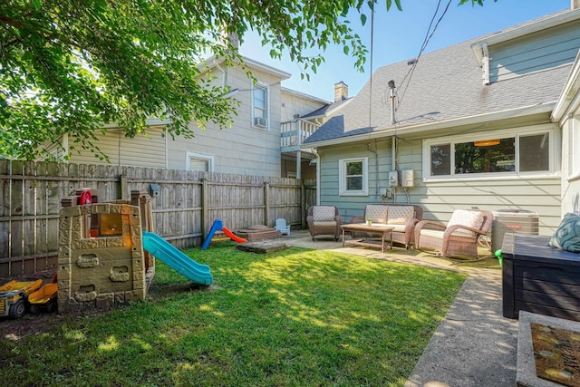 162 Watt St, Circleville, OH 43113 - back of property featuring a fenced backyard, an outdoor hangout area, a shingled roof, and a playground