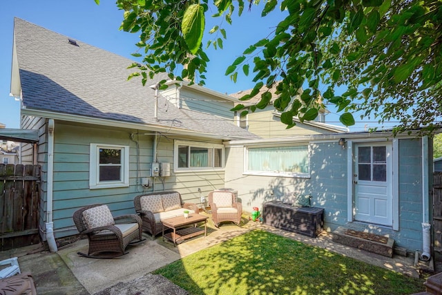 162 Watt St, Circleville, OH 43113 - back of house featuring an outdoor hangout area, a patio area, and roof with shingles
