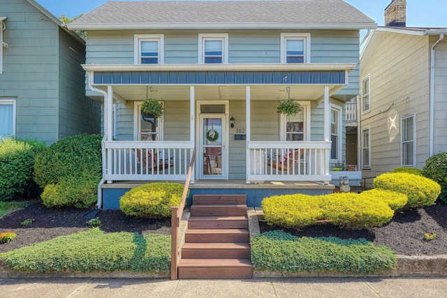 162 Watt St, Circleville, OH 43113 - view of front facade with covered porch and a shingled roof