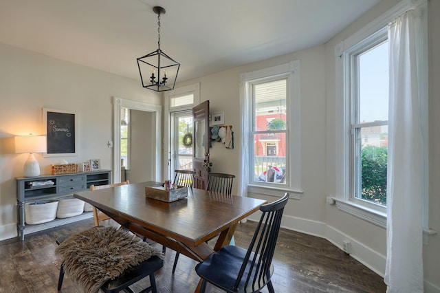 162 Watt St, Circleville, OH 43113 - dining space featuring plenty of natural light, a chandelier, and dark wood-style flooring