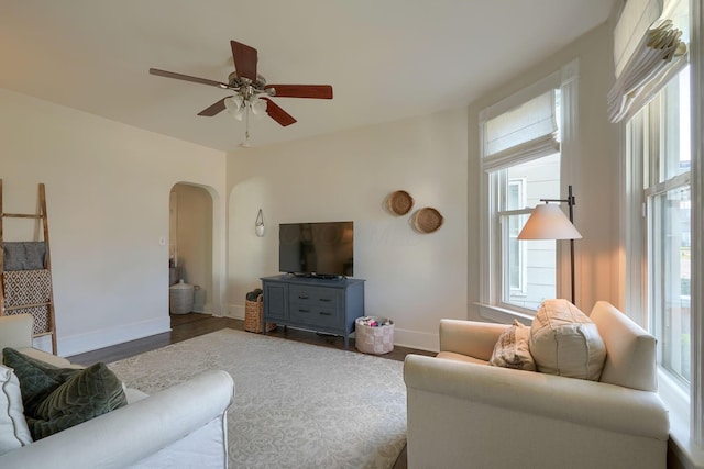 162 Watt St, Circleville, OH 43113 - living area featuring arched walkways, ceiling fan, and wood finished floors