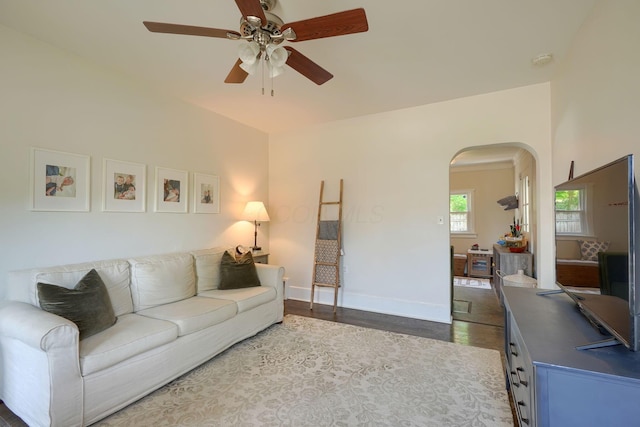 162 Watt St, Circleville, OH 43113 - living area with arched walkways, a ceiling fan, and dark wood-style floors