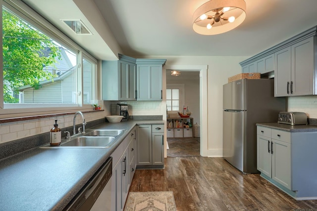 162 Watt St, Circleville, OH 43113 - kitchen featuring freestanding refrigerator, dark wood-type flooring, backsplash, and healthy amount of natural light
