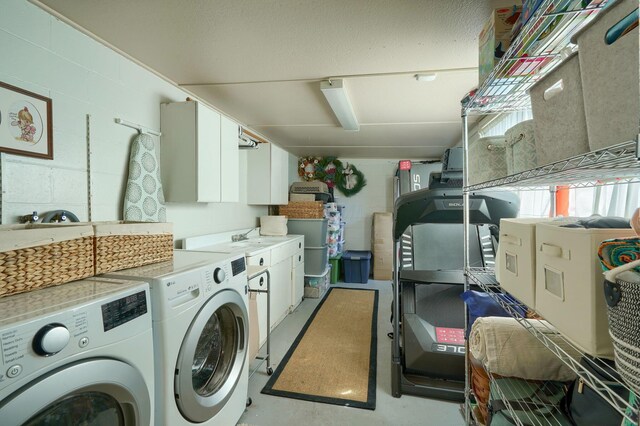 162 Watt St, Circleville, OH 43113 - washroom with cabinet space, separate washer and dryer, and concrete block wall