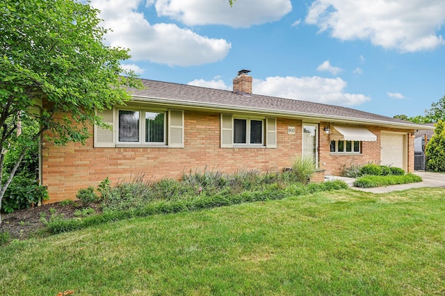 902 Brentford Dr, Columbus, OH 43220 - ranch-style house with an attached garage, a front yard, a chimney, brick siding, and driveway