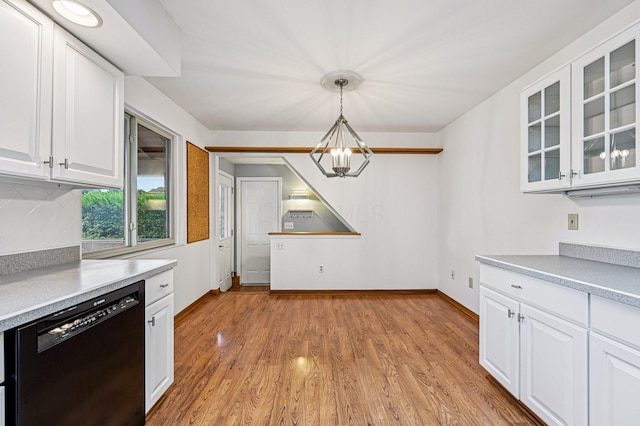 902 Brentford Dr, Columbus, OH 43220 - kitchen with dishwasher, glass insert cabinets, white cabinetry, light wood finished floors, and a chandelier