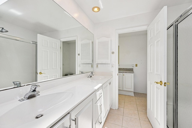 902 Brentford Dr, Columbus, OH 43220 - bathroom with a stall shower, double vanity, and tile patterned floors