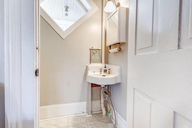 100 E Ohio Ave, Mount Vernon, OH 43050 - bathroom with marble look tiles and baseboards
