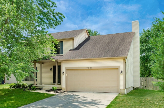 7345 Oakmeadows Dr, Columbus, OH 43085 - traditional-style home featuring an attached garage, driveway, a chimney, and roof with shingles