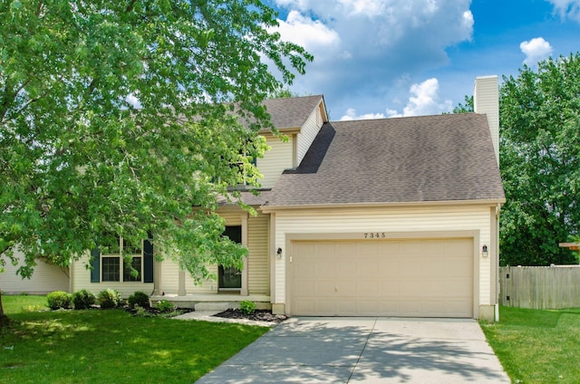 7345 Oakmeadows Dr, Columbus, OH 43085 - view of front of home featuring an attached garage, driveway, a chimney, and a shingled roof
