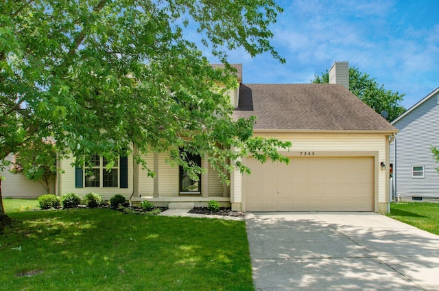 7345 Oakmeadows Dr, Columbus, OH 43085 - view of front of property with a garage, concrete driveway, a front lawn, and a chimney