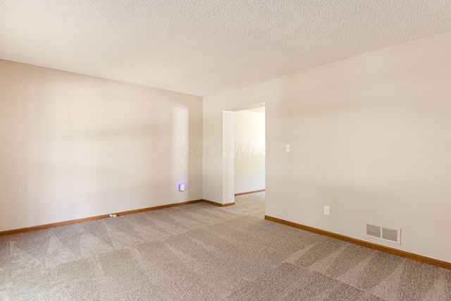 7345 Oakmeadows Dr, Columbus, OH 43085 - spare room with light carpet and a textured ceiling