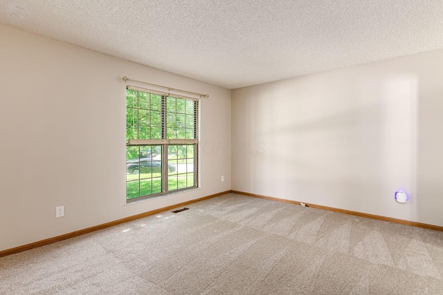 7345 Oakmeadows Dr, Columbus, OH 43085 - carpeted spare room featuring baseboards and a textured ceiling