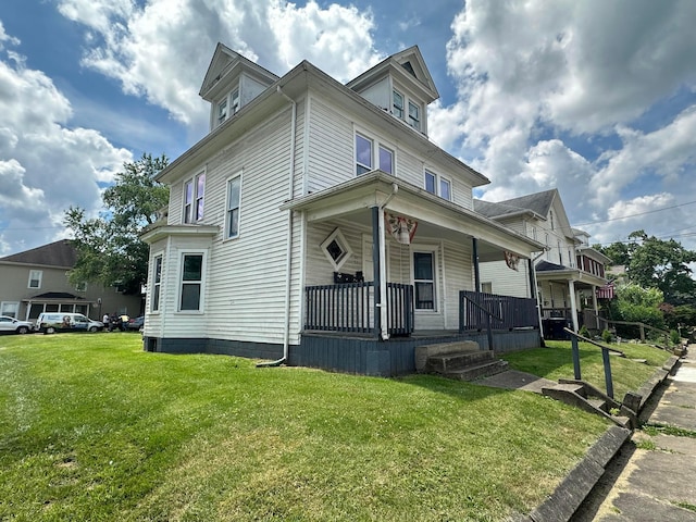 51 E N St, Newark, OH 43055 - american foursquare style home with a porch and a front lawn