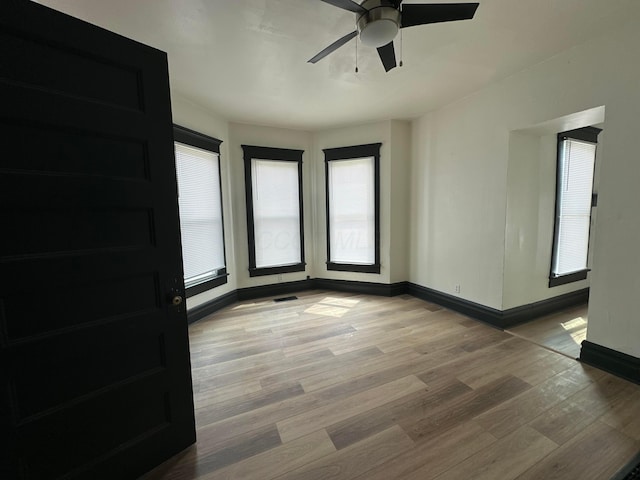 51 E N St, Newark, OH 43055 - unfurnished room with light wood-type flooring and a ceiling fan