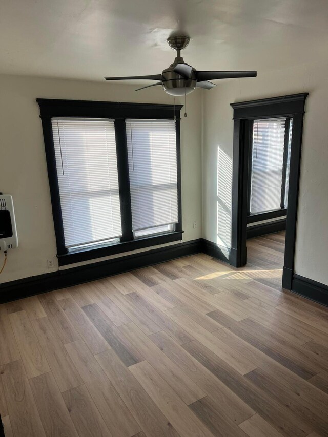 51 E N St, Newark, OH 43055 - spare room featuring a ceiling fan, wood finished floors, and heating unit