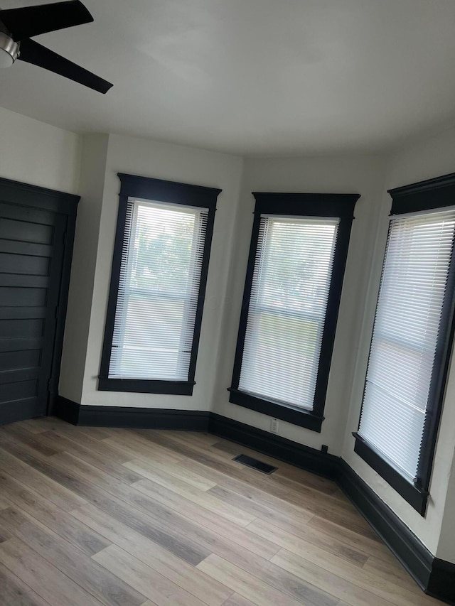 51 E N St, Newark, OH 43055 - empty room with light wood-style flooring and a ceiling fan