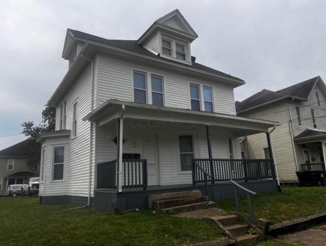 51 E N St, Newark, OH 43055 - traditional style home featuring a porch and a front lawn