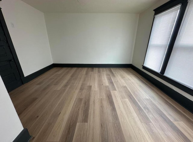 51 E N St, Newark, OH 43055 - unfurnished room featuring light wood-type flooring