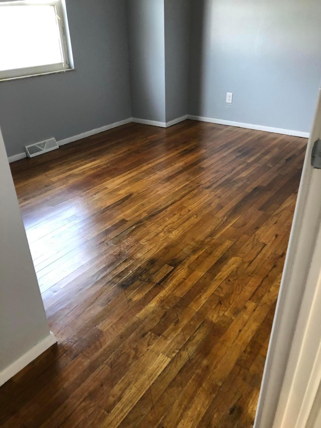 1703 Quigley Rd, Columbus, OH 43227 - empty room with dark wood finished floors and baseboards