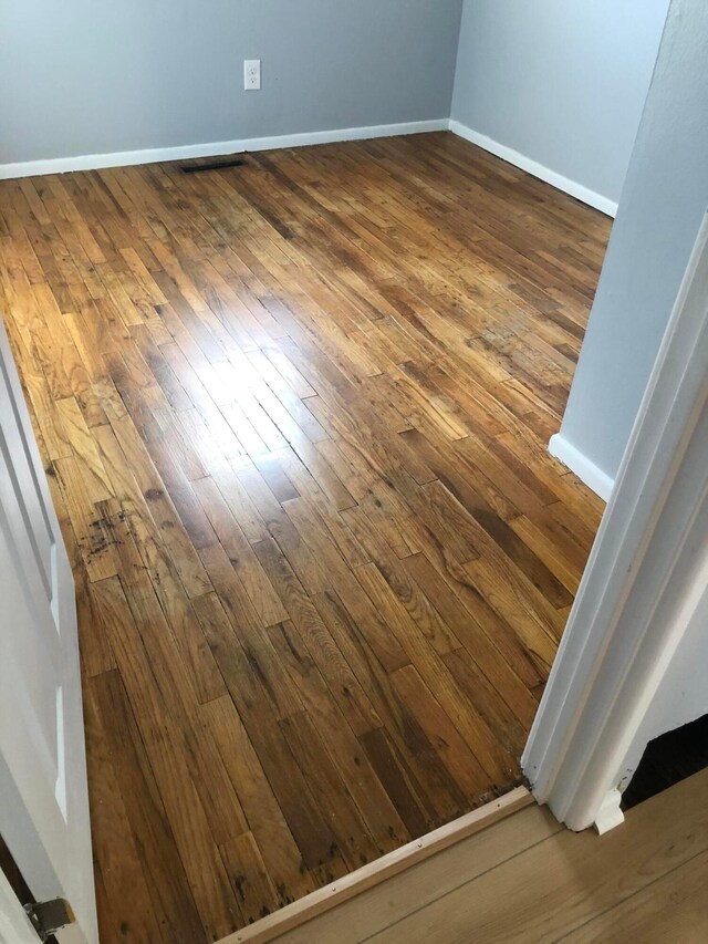 1703 Quigley Rd, Columbus, OH 43227 - detailed view of wood finished floors and baseboards