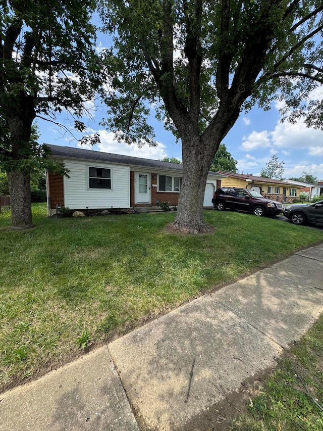 1703 Quigley Rd, Columbus, OH 43227 - ranch-style house with brick siding and a front lawn