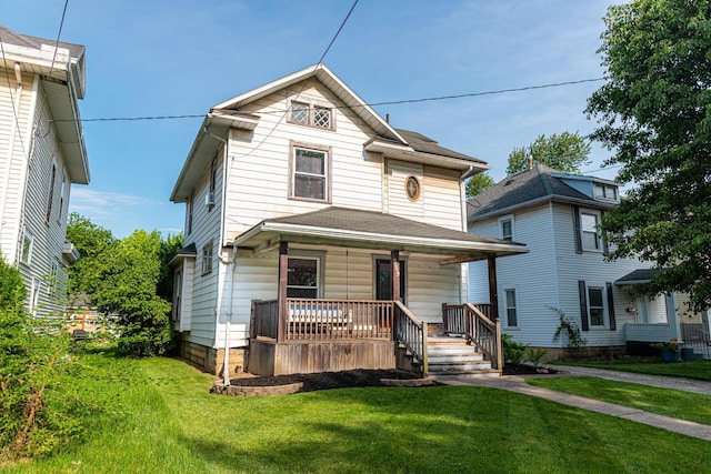 559 Pearl St, Marion, OH 43302 - view of front facade with covered porch and a front yard